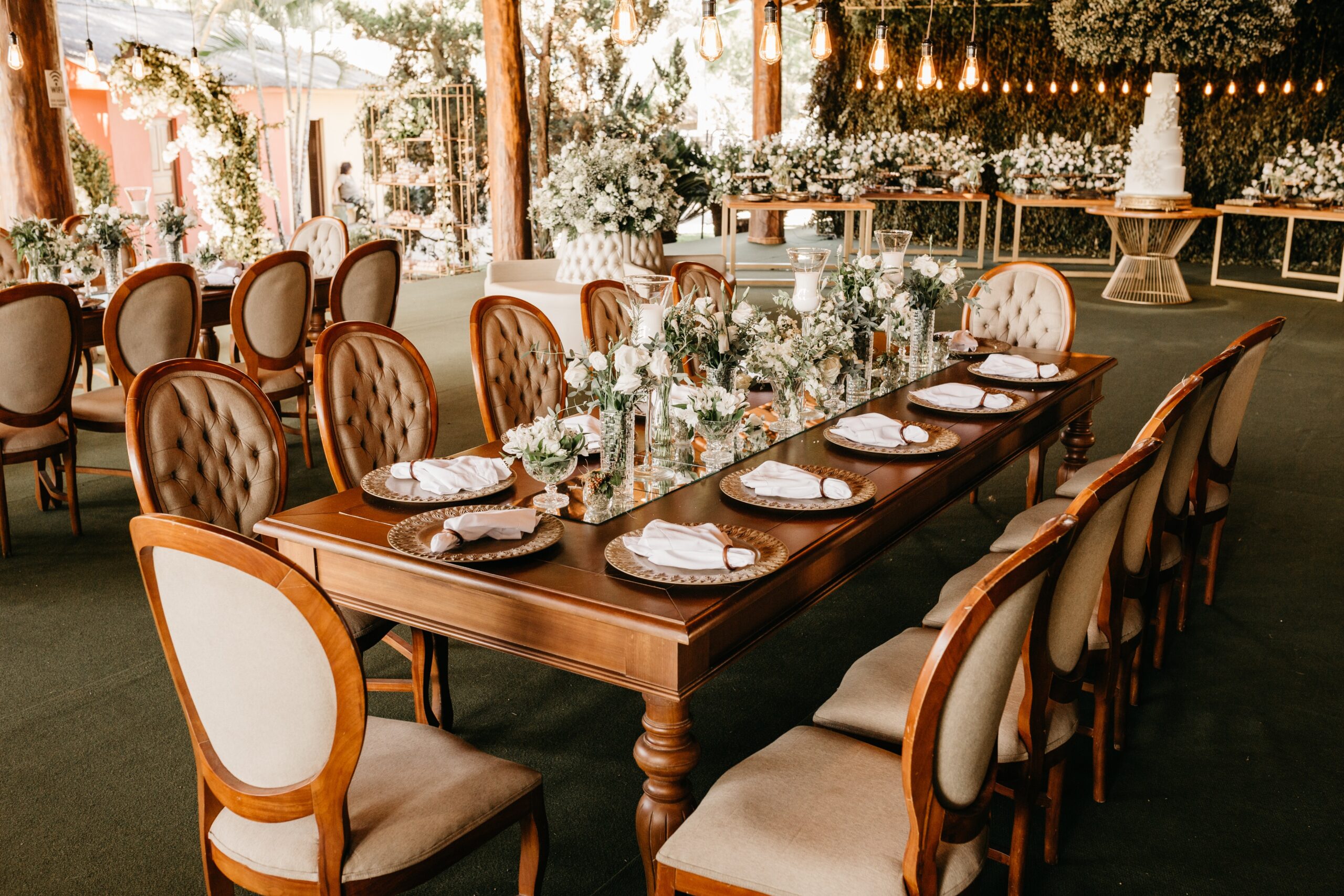 Photo by Jonathan Borba: https://www.pexels.com/photo/wedding-venue-with-table-setting-and-white-flowers-12876485/